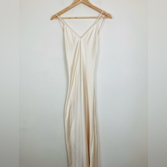 Zara Dresses & Skirts - Zara cream satin slip dress with crisscross detail at back. Midi length. Size XS
